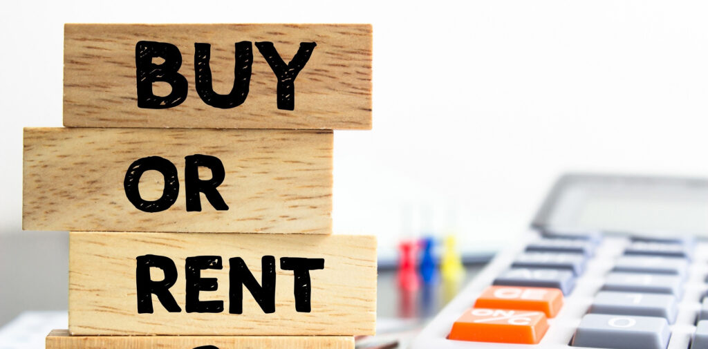a wooden block with the words buy or rent on it