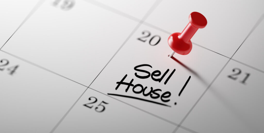a calendar with the word ' sell house ' written on it