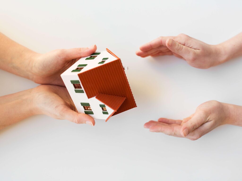 two hands holding a small box
