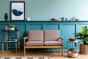 a living room with a couch and a plant