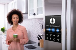 a woman standing in a kitchen with a smart home appliance
