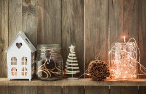 a shelf with christmas decorations and lights