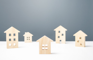 wooden houses on a white surface