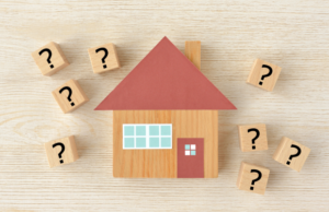 a house surrounded by question marks