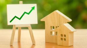a house and a house with a green arrow on the top