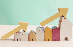 a wooden house with a arrow pointing up