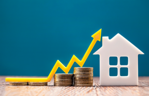 a house and a stack of coins with a rising arrow