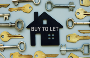 a bunch of keys with a house shaped key