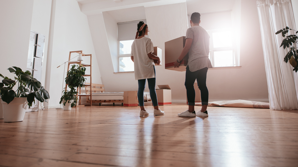 a couple moving into their new home