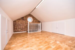 a room with a brick wall