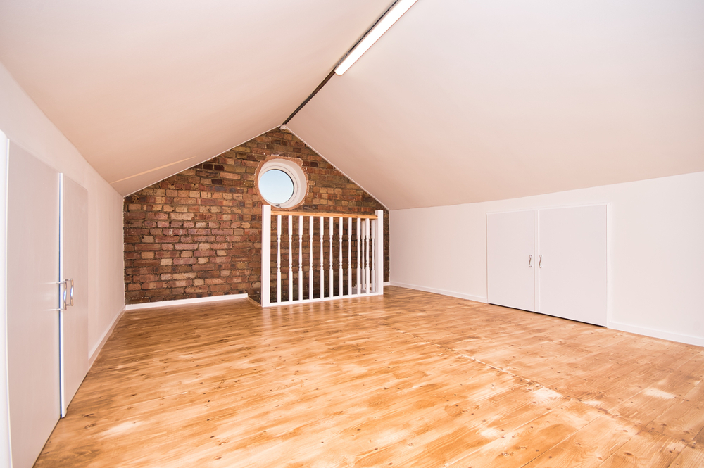 a room with a brick wall