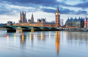 a view of a city with a bridge and a clock tower