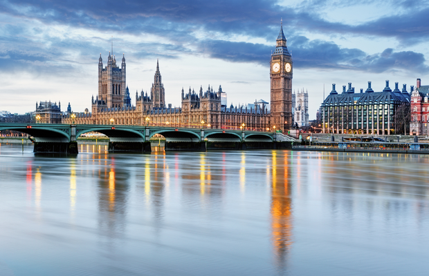 a view of a city with a bridge and a clock tower