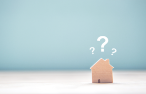 a small house with a question mark on the top