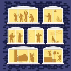 Silhouettes of individuals visible in illuminated windows at night.
