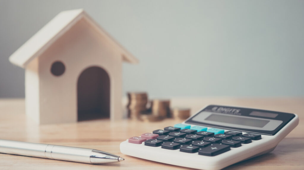 a calculator and a pen on a table