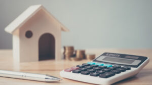 a calculator and a pen on a table