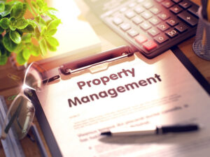 Property management tools: clipboard, calculator, and glasses.