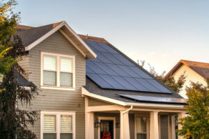 a house with a solar panel on the roof