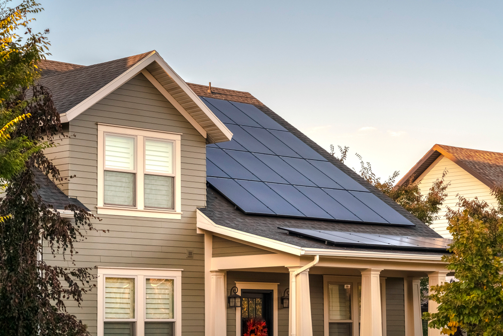 a house with a solar panel on the roof