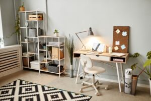 a room with a desk, chair, and a window
