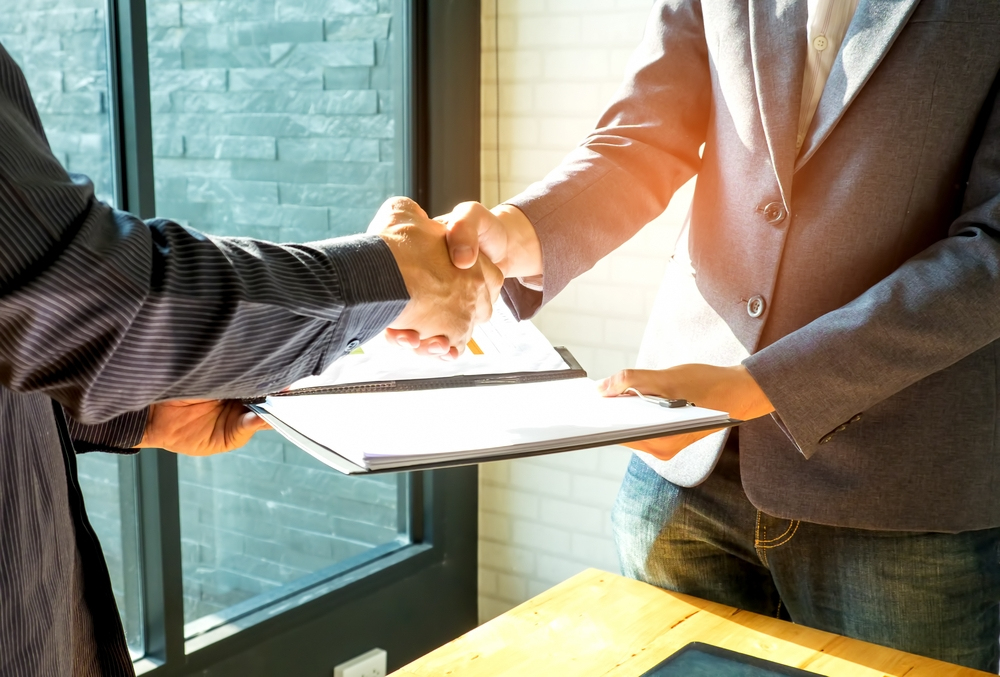 two men shaking hands