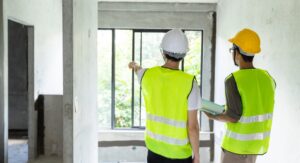 Engineers inspecting building for cladding risks and leaseholder safety compliance