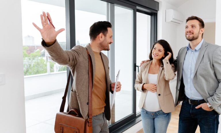 Lettings agent conducting a rental property viewing with prospective tenants in a modern Tonbridge apartment