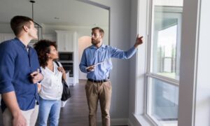 Letting agent conducting a property walkthrough with tenants in a Tonbridge rental home as landlords prepare for the 2026 Decent Homes Standard inspections
