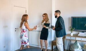 Letting agent introducing new tenants to a rental property in Golders Green, London.