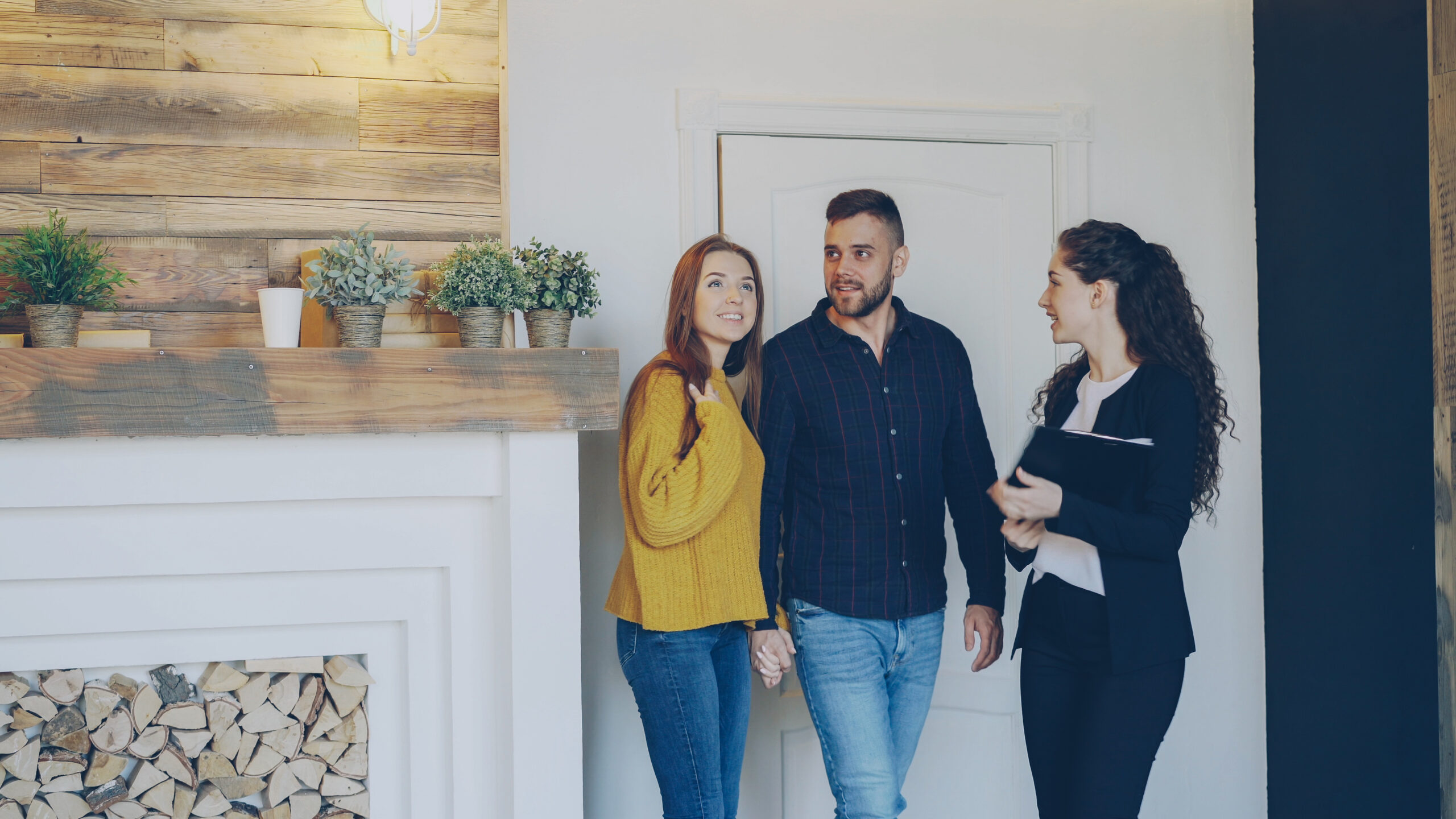 Young couple being shown around a rental property by a letting agent in Tonbridge.