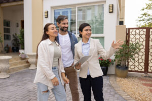Letting agent showing a rental property to prospective tenants, representing professional property management for landlords in Bounds Green.