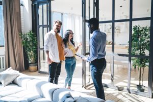 Estate agent showing buyers around a home in Bounds Green N11
