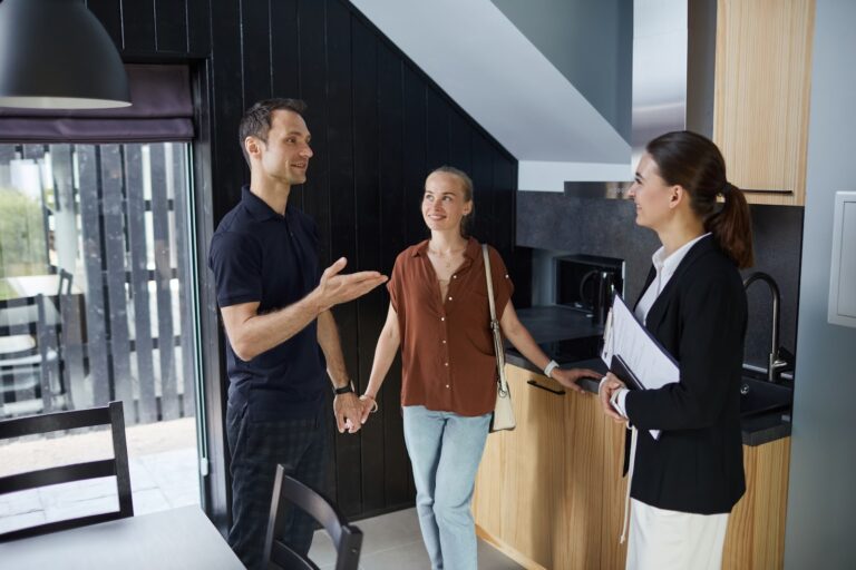 Estate agent meeting buyers at a property in North Finchley N12